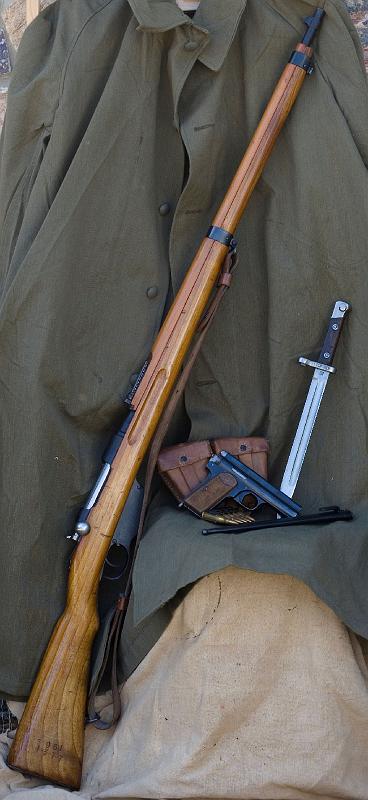 a-0939.jpg - 1895 Steyr-Mannlicher rifle and bayonet and Frommer Stop pistol.  Both the pisto and rifle were manufactured in 1917 and are representative of the arms used by the Austro-Hungarian Empire in World War I.