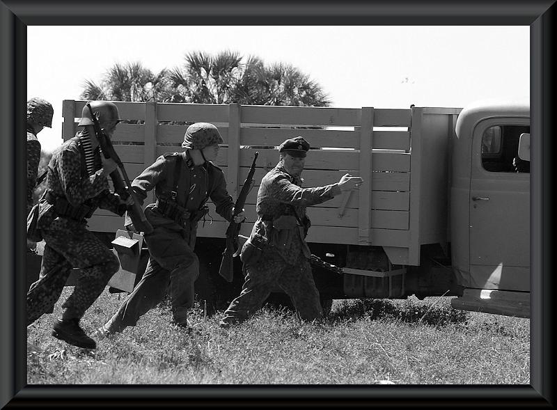 IMGP0776RS.JPG - German troops deploying from a transport.  Another shot taken by my wife with the K100d.  B&W conversions done with Paint Shop Pro.
